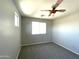 Bedroom with baseball-themed ceiling fan and carpet at 17323 W Woodlands Ave, Goodyear, AZ 85338