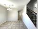 Bright dining room with tile floors and access to the kitchen and stairs at 17323 W Woodlands Ave, Goodyear, AZ 85338