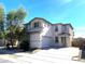 Two-story house with attached garage and landscaped front yard at 17323 W Woodlands Ave, Goodyear, AZ 85338