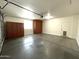 Spacious garage with storage and access door at 17323 W Woodlands Ave, Goodyear, AZ 85338