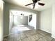 Spacious living room with tile floors and ceiling fan at 17323 W Woodlands Ave, Goodyear, AZ 85338