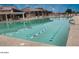 Large lap pool with lane markers and a nearby building complete with ample seating at 17200 W Bell Rd # 667, Surprise, AZ 85374