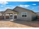 Home showcasing a backyard with a covered patio, perfect for outdoor enjoyment at 4107 E Ghost Flower Ln, San Tan Valley, AZ 85140