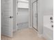 Bright bathroom with an enclosed shower and a view of a large walk in closet at 4107 E Ghost Flower Ln, San Tan Valley, AZ 85140