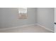 Cozy bedroom with a window letting in natural light and tile flooring at 4107 E Ghost Flower Ln, San Tan Valley, AZ 85140