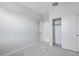 A bedroom with gray carpet and neutral walls also features a closet with sliding doors at 4107 E Ghost Flower Ln, San Tan Valley, AZ 85140