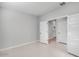 This bedroom features white tile floors and double doors that lead to another room at 4107 E Ghost Flower Ln, San Tan Valley, AZ 85140