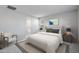 Serene bedroom featuring a comfortable bed, soft lighting, and a cozy sitting area at 4107 E Ghost Flower Ln, San Tan Valley, AZ 85140