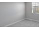 This bedroom features gray carpet and neutral walls with a window at 4107 E Ghost Flower Ln, San Tan Valley, AZ 85140