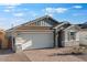 Beautiful home with a spacious two-car garage and charming exterior details at 4107 E Ghost Flower Ln, San Tan Valley, AZ 85140