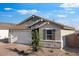 Charming home featuring a two-car garage and nicely landscaped front yard at 4107 E Ghost Flower Ln, San Tan Valley, AZ 85140