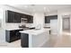 Bright kitchen with a large island, stainless steel appliances, and plenty of cabinet space at 4107 E Ghost Flower Ln, San Tan Valley, AZ 85140