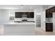 Modern kitchen with stainless steel appliances, sleek countertops, and a convenient pantry at 4107 E Ghost Flower Ln, San Tan Valley, AZ 85140