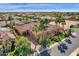 Aerial view of the luxury home with a tile roof, lush landscaping and a circular driveway at 4301 E Taurus Pl, Chandler, AZ 85249