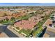 An aerial view of a desert home with solar panels and a beautiful tile roof at 4301 E Taurus Pl, Chandler, AZ 85249