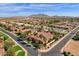 Expansive aerial view of a luxury home with mountain views and lush landscaping at 4301 E Taurus Pl, Chandler, AZ 85249