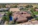 This backyard oasis with desert plants also features solar panels and a sparkling pool at 4301 E Taurus Pl, Chandler, AZ 85249