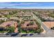 An aerial view of the home in a gated community showcasing the expansive desert landscape at 4301 E Taurus Pl, Chandler, AZ 85249