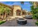 Backyard featuring a fire pit, covered patio, and view of the house at 4301 E Taurus Pl, Chandler, AZ 85249