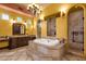 This bathroom features a large tub, a walk-in shower, and double vanities at 4301 E Taurus Pl, Chandler, AZ 85249