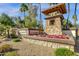 Elaborate Vasaro community entrance sign with stone tower, desert landscaping, and flowers at 4301 E Taurus Pl, Chandler, AZ 85249