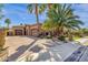 Paver driveway leading to a three-car garage with desert landscaping at 4301 E Taurus Pl, Chandler, AZ 85249