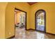 Elegant foyer features tile floors and decorative wrought iron door leading to a comfortable sitting area at 4301 E Taurus Pl, Chandler, AZ 85249