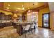 Gourmet kitchen featuring an island with seating and granite countertops at 4301 E Taurus Pl, Chandler, AZ 85249