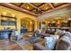 Spacious living area with coffered ceilings, a wet bar, and an open floor plan at 4301 E Taurus Pl, Chandler, AZ 85249