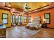 This spacious main bedroom features a sitting area with a bay window and wood-style floors at 4301 E Taurus Pl, Chandler, AZ 85249