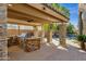 The outdoor kitchen is fully equipped for entertaining, adjacent to the pool and lounging area at 4301 E Taurus Pl, Chandler, AZ 85249