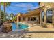 An outdoor view of the pool showcasing the elegant architecture of the home and covered patio at 4301 E Taurus Pl, Chandler, AZ 85249