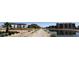 Exterior shot of a sidewalk next to the canal, condo, and landscaping at 4803 N Woodmere Fairway -- # 2006, Scottsdale, AZ 85251