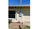 Beige exterior showing window, utility box, and single car garage at 10621 W Oakmont Dr, Sun City, AZ 85351