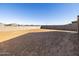 Empty lot backyard with block wall at 17738 W Coolidge St, Goodyear, AZ 85395