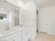 Modern bathroom with double vanity and white cabinets at 17738 W Coolidge St, Goodyear, AZ 85395