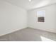 Well-lit bedroom with neutral walls and carpet at 17738 W Coolidge St, Goodyear, AZ 85395