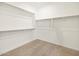 Walk-in closet with ample shelving and hanging space at 17738 W Coolidge St, Goodyear, AZ 85395