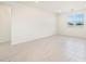 Spacious living room with tile flooring and large windows at 17738 W Coolidge St, Goodyear, AZ 85395