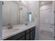 Shared bathroom with double vanity and bathtub at 19026 W Ocotillo Rd, Waddell, AZ 85355