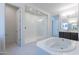 Spa-like bathroom with soaking tub and shower at 19026 W Ocotillo Rd, Waddell, AZ 85355