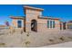 Modern home with stone accents and an arched entryway at 19026 W Ocotillo Rd, Waddell, AZ 85355