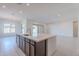 Eat-in kitchen with large island and sliding door to backyard at 19026 W Ocotillo Rd, Waddell, AZ 85355