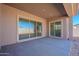 Covered patio with sliding glass doors leading to backyard at 19026 W Ocotillo Rd, Waddell, AZ 85355