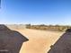 Large backyard with desert landscaping is surrounded by block and wrought iron fences at 25975 N 160Th Ln, Surprise, AZ 85387