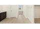 Bathroom featuring wood-look tile flooring and a doorway view of the bedroom and walk-in closet at 25975 N 160Th Ln, Surprise, AZ 85387