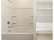 A shower-tub combo and an adjacent linen closet with shelving for storage at 25975 N 160Th Ln, Surprise, AZ 85387