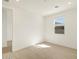 Bright bedroom with wood-look flooring, white walls, and a window with modern blinds at 25975 N 160Th Ln, Surprise, AZ 85387