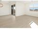 Bright living area with tile floors, sliding glass doors, and a modern light fixture at 25975 N 160Th Ln, Surprise, AZ 85387