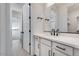 Modern bathroom with white cabinets and quartz countertop at 5923 N 83Rd Ln, Glendale, AZ 85305